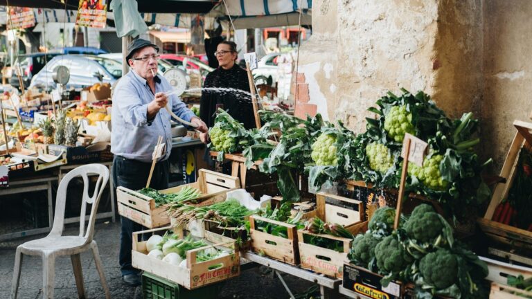 man watering vegetables